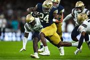 26 August 2023; Notre Dame running back Jadarian Price #24 on his way to scoring his side's second touchdown during the Aer Lingus College Football Classic match between Notre Dame and Navy Midshipmen at the Aviva Stadium in Dublin. Photo by Brendan Moran/Sportsfile
