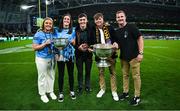 26 August 2023; Dublin footballers, from left, Abbie Shiels and Hannah Tyrrell with the Brendan Martin Cup, and Killian McGinnis, Adam Fearon and Ciarán Kilkenny with the Sam Maguire Cup during the Aer Lingus College Football Classic match between Notre Dame and Navy Midshipmen at the Aviva Stadium in Dublin. Photo by Brendan Moran/Sportsfile