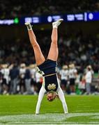 26 August 2023; A Notre Dame cheerleader performs during the Aer Lingus College Football Classic match between Notre Dame and Navy Midshipmen at the Aviva Stadium in Dublin. Photo by Ben McShane/Sportsfile