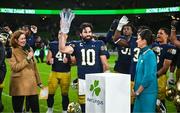 26 August 2023; Notre Dame quarterback Sam Hartman #10 is presented with the MVP award after the Aer Lingus College Football Classic match between Notre Dame and Navy Midshipmen at the Aviva Stadium in Dublin. Photo by Ben McShane/Sportsfile