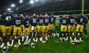 26 August 2023; Notre Dame players celebrate after the Aer Lingus College Football Classic match between Notre Dame and Navy Midshipmen at the Aviva Stadium in Dublin. Photo by Ben McShane/Sportsfile