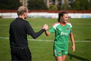 26 August 2023; Eve Mangan of Cork City and assistant referee Wayne McDonnell after the Sports Direct Women’s FAI Cup first round match between Terenure Rangers and Cork City at Richmond Park in Dublin. Photo by Stephen McCarthy/Sportsfile