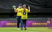 27 August 2023; Fox Lodge bowler Lucy Neely, 8, celebrates with wicketkeeper Hannah McLoughlin after bowling out Merrion's Annabel Squires during the Arachas Women's All-Ireland T20 Cup Final match between Merrion and Fox Lodge at Malahide Cricket Ground in Dublin. Photo by Seb Daly/Sportsfile
