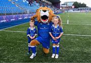 26 August 2023; Leo the Lion with mascots Alex O'Friel and Aoibheann Geoghegan before the Vodafone Women’s Interprovincial Championship match between Leinster and Munster at Energia Park in Dublin. Photo by Piaras Ó Mídheach/Sportsfile
