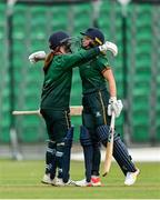 27 August 2023; Merrion batter Leah Paul, right, is congratulated by teammate Rachel Delaney after bringing up her half century during the Arachas Women's All-Ireland T20 Cup Final match between Merrion and Fox Lodge at Malahide Cricket Ground in Dublin. Photo by Seb Daly/Sportsfile