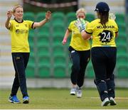 27 August 2023; Fox Lodge bowler Elle Moore, left, celebrates after claiming the wicket of Merrion's Isabel Light during the Arachas Women's All-Ireland T20 Cup Final match between Merrion and Fox Lodge at Malahide Cricket Ground in Dublin. Photo by Seb Daly/Sportsfile