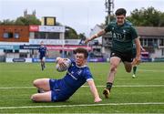 27 August 2023; Harley Fagan Harold of Leinster scores his side's first try under pressure from Tom Sheehan of Connacht during the U18 Clubs Interprovincial Championship match between Leinster and Connacht at Energia Park in Dublin. Photo by Piaras Ó Mídheach/Sportsfile