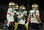 26 August 2023; Navy Midshipmen quarterback Tai Lavatai #1, left, and teammates react after losing a down during the Aer Lingus College Football Classic match between Notre Dame and Navy Midshipmen at the Aviva Stadium in Dublin. Photo by Brendan Moran/Sportsfile
