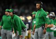 26 August 2023; Notre Dame head coach Marcus Freeman, right, and special teams coordinator Marty Biagi during the Aer Lingus College Football Classic match between Notre Dame and Navy Midshipmen at the Aviva Stadium in Dublin. Photo by Brendan Moran/Sportsfile