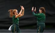 27 August 2023; Merrion bowler Julianne Morrissey, right, is congratulated by teammate Niamh MacNulty after dismissing Fox Lodge's Tanisha Hussain during the Arachas Women's All-Ireland T20 Cup Final match between Merrion and Fox Lodge at Malahide Cricket Ground in Dublin. Photo by Seb Daly/Sportsfile