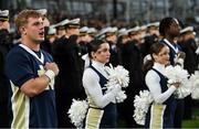 26 August 2023; Members of the Navy cheerleaders stand for the national anthem before the Aer Lingus College Football Classic match between Notre Dame and Navy Midshipmen at the Aviva Stadium in Dublin. Photo by Brendan Moran/Sportsfile