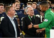 26 August 2023; Notre Dame president Rev John I Jenkins congratulates Notre Dame head coach Marcus Freeman during the Aer Lingus College Football Classic match between Notre Dame and Navy Midshipmen at the Aviva Stadium in Dublin. Photo by Brendan Moran/Sportsfile