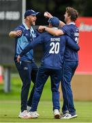 27 August 2023; Andrew Darroch of Balbriggan, right, is congratulated by teammates Cameron Rowe, 20, and Matthew Pollard after catching out Ross Adair of CIYMS during the Arachas Men's All-Ireland T20 Cup Final match between Balbriggan and CIYMS at Malahide Cricket Ground in Dublin. Photo by Seb Daly/Sportsfile