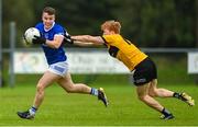 27 August 2023; Eunan Doherty of Naomh Conaill in action against Eoin McGeehin of St Eunan's during the Donegal County Senior Club Football Championship match between Naomh Conaill and St Eunan's at Davy Brennan Memorial Park in Gortnamucklagh, Donegal. Photo by Ramsey Cardy/Sportsfile