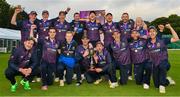 27 August 2023; CIYMS players and staff celebrate with the trophy after thier victory in the Arachas Men's All-Ireland T20 Cup Final match between Balbriggan and CIYMS at Malahide Cricket Ground in Dublin. Photo by Seb Daly/Sportsfile