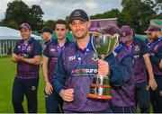 27 August 2023; Chris Dougherty of CIYMS with the trophy after the Arachas Men's All-Ireland T20 Cup Final match between Balbriggan and CIYMS at Malahide Cricket Ground in Dublin. Photo by Seb Daly/Sportsfile