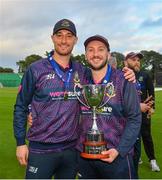 27 August 2023; CIYMS players Chris Dougherty, left, and John Matchett with the trophy after the Arachas Men's All-Ireland T20 Cup Final match between Balbriggan and CIYMS at Malahide Cricket Ground in Dublin. Photo by Seb Daly/Sportsfile