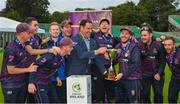 27 August 2023; CIYMS captain John Matchett is presented with the trophy by Mayor of Fingal, Councillor Adrian Henchy after the Arachas Men's All-Ireland T20 Cup Final match between Balbriggan and CIYMS at Malahide Cricket Ground in Dublin. Photo by Seb Daly/Sportsfile