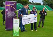 27 August 2023; CIYMS captain John Matchett is presented with the winner's cheque by Mayor of Fingal, Councillor Adrian Henchy after the Arachas Men's All-Ireland T20 Cup Final match between Balbriggan and CIYMS at Malahide Cricket Ground in Dublin. Photo by Seb Daly/Sportsfile