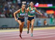 27 August 2023; Sharlene Mawdsley of Ireland takes the baton from teammate Kelly McGrory as they compete in the Women's 4x400m Relay final during day nine of the World Athletics Championships at the National Athletics Centre in Budapest, Hungary. Photo by Sam Barnes/Sportsfile