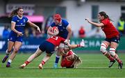 26 August 2023; Aoife Wafer of Leinster is tackled by Alana McInerney, left, and Stephanie Nunan of Munster during the Vodafone Women’s Interprovincial Championship match between Leinster and Munster at Energia Park in Dublin. Photo by Piaras Ó Mídheach/Sportsfile