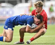 30 August 2023; Derry Moloney of Leinster is tackled by Leo O’Leary of Munster during the U18 Schools Interprovincial Championship match between Leinster and Munster at Energia Park in Dublin. Photo by Harry Murphy/Sportsfile