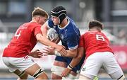 30 August 2023; Dylan McNiece of Leinster is tackled by Joe Finn and Daniel Foley of Munster during the U18 Schools Interprovincial Championship match between Leinster and Munster at Energia Park in Dublin. Photo by Harry Murphy/Sportsfile