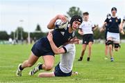 30 August 2023; Daniel Gill of North Midlands dives over to score a try despite the efforts of Conor Casey of Midlands during the BearingPoint Shane Horgan Cup match between North Midlands and Midlands at Cill Dara RFC in Kildare. Photo by Tyler Miller/Sportsfile