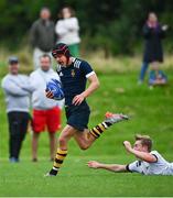30 August 2023; Joshua O'Keeffe of North Midlands on his way to scoring his side a try despite the efforts of Alex Bagnall of Midlands during the BearingPoint Shane Horgan Cup match between North Midlands and Midlands at Cill Dara RFC in Kildare. Photo by Tyler Miller/Sportsfile