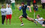 30 August 2023; Joshua O'Keeffe of North Midlands on his way to scoring his side a try despite the efforts of Alex Bagnall of Midlands during the BearingPoint Shane Horgan Cup match between North Midlands and Midlands at Cill Dara RFC in Kildare. Photo by Tyler Miller/Sportsfile