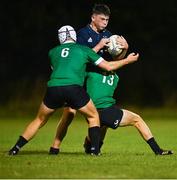 30 August 2023; Harry Heaghney of Metro is tackled by Cillian McElwee, left, and Zak Hernan of South East during the BearingPoint Shane Horgan Cup match between South East and Metro at Cill Dara RFC in Kildare. Photo by Tyler Miller/Sportsfile