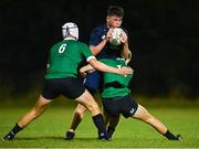 30 August 2023; Harry Heaghney of Metro is tackled by Cillian McElwee, left, and Zak Hernan of South East during the BearingPoint Shane Horgan Cup match between South East and Metro at Cill Dara RFC in Kildare. Photo by Tyler Miller/Sportsfile