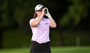 1 September 2023; Leona Maguire of Ireland uses a range finder to check the distance to the 18th hole during day two of the KPMG Women's Irish Open Golf Championship at Dromoland Castle in Clare. Photo by Eóin Noonan/Sportsfile