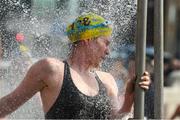 2 September 2023; Catherine de Blacam takes a shower after competing in the 103rd Jones Engineering Liffey Swim organised by Leinster Open Sea. Photo by Ray McManus/Sportsfile