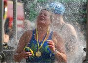 2 September 2023; Michelle Nolan, NAC Masters, takes a shower after competing in the 103rd Jones Engineering Liffey Swim organised by Leinster Open Sea. Photo by Ray McManus/Sportsfile