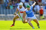 3 September 2023; Thomas Douglas of De La Salle in action against Billy Nolan of Roanmore during the Waterford County Senior Club Hurling Championship Semi-Final match between De La Salle and Roanmore at Walsh Park in Waterford. Photo by Seb Daly/Sportsfile