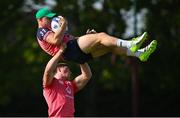 5 September 2023; Garry Ringrose is lifted by Joe McCarthy during an Ireland rugby squad training session at Complexe de la Chambrerie in Tours, France. Photo by Brendan Moran/Sportsfile