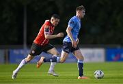 6 September 2023; Ciaran Behan of UCD in action against Ciarán Coll of Derry City during the SSE Airtricity Men's Premier Division match between UCD and Derry City at UCD Bowl in Dublin. Photo by Ben McShane/Sportsfile