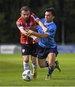 6 September 2023; Sean Brennan of UCD in action against Paul McMullan of Derry City during the SSE Airtricity Men's Premier Division match between UCD and Derry City at UCD Bowl in Dublin. Photo by Ben McShane/Sportsfile