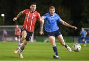 6 September 2023; Cian Kavanagh of Derry City in action against Jack Keaney of UCD during the SSE Airtricity Men's Premier Division match between UCD and Derry City at UCD Bowl in Dublin. Photo by Ben McShane/Sportsfile