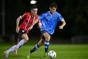 6 September 2023; Donal Higgins of UCD in action against Jordan McEneff of Derry City during the SSE Airtricity Men's Premier Division match between UCD and Derry City at UCD Bowl in Dublin. Photo by Ben McShane/Sportsfile