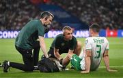 7 September 2023; Enda Stevens of Republic of Ireland is treated by Republic of Ireland chartered physiotherapist Danny Miller, centre, and Republic of Ireland team doctor Sean Carmody during the UEFA EURO 2024 Championship qualifying group B match between France and Republic of Ireland at Parc des Princes in Paris, France. Photo by Stephen McCarthy/Sportsfile
