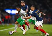 7 September 2023; Adam Idah of Republic of Ireland in action against Theo Hernández, centre, and Lucas Hernández of France during the UEFA EURO 2024 Championship qualifying group B match between France and Republic of Ireland at Parc des Princes in Paris, France. Photo by Seb Daly/Sportsfile