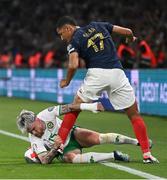 7 September 2023; Aaron Connolly of Republic of Ireland in action against William Saliba of France during the UEFA EURO 2024 Championship qualifying group B match between France and Republic of Ireland at Parc des Princes in Paris, France. Photo by Stephen McCarthy/Sportsfile