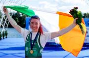 8 September 2023; Siobhan McCrohan of Ireland celebrates with the Irish tricolour and her gold medal after finishing first with a time of 8:47.96 in the Lightweight Women's Single Sculls final A during the 2023 World Rowing Championships at Ada Ciganlija regatta course on Sava Lake, Belgrade. Photo by Nikola Krstic/Sportsfile