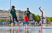 8 September 2023; Ireland supporters Dearhla Whyte and David Kelly with their children Donagh, age 6, and Laragh, age 8, from Ballinteer in Dublin, while enjoying the sunshine in Bordeaux, France, ahead of Ireland's first Rugby World Cup 2023 game against Romania. Photo by Brendan Moran/Sportsfile