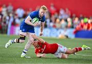 8 September 2023; Jamie Osborne of Leinster evades the tackle of Tony Butler of Munster during the pre-season friendly match between Munster and Leinster at Musgrave Park in Cork. Photo by Sam Barnes/Sportsfile