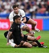 8 September 2023; Rieko Ioane of New Zealand is tackled by Yoram Moefana, left, and Damien Penaud of France during the 2023 Rugby World Cup Pool A match between France and New Zealand at the Stade de France in Paris, France. Photo by Harry Murphy/Sportsfile