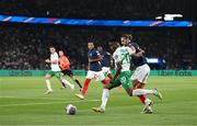 7 September 2023; Chiedozie Ogbene of Republic of Ireland in action against Adrien Rabiot of France during the UEFA EURO 2024 Championship qualifying group B match between France and Republic of Ireland at Parc des Princes in Paris, France. Photo by Stephen McCarthy/Sportsfile