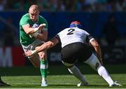 9 September 2023; Keith Earls of Ireland is tackled by Ovidiu Cojocaru of Romania during the 2023 Rugby World Cup Pool B match between Ireland and Romania at Stade de Bordeaux in Bordeaux, France. Photo by Harry Murphy/Sportsfile